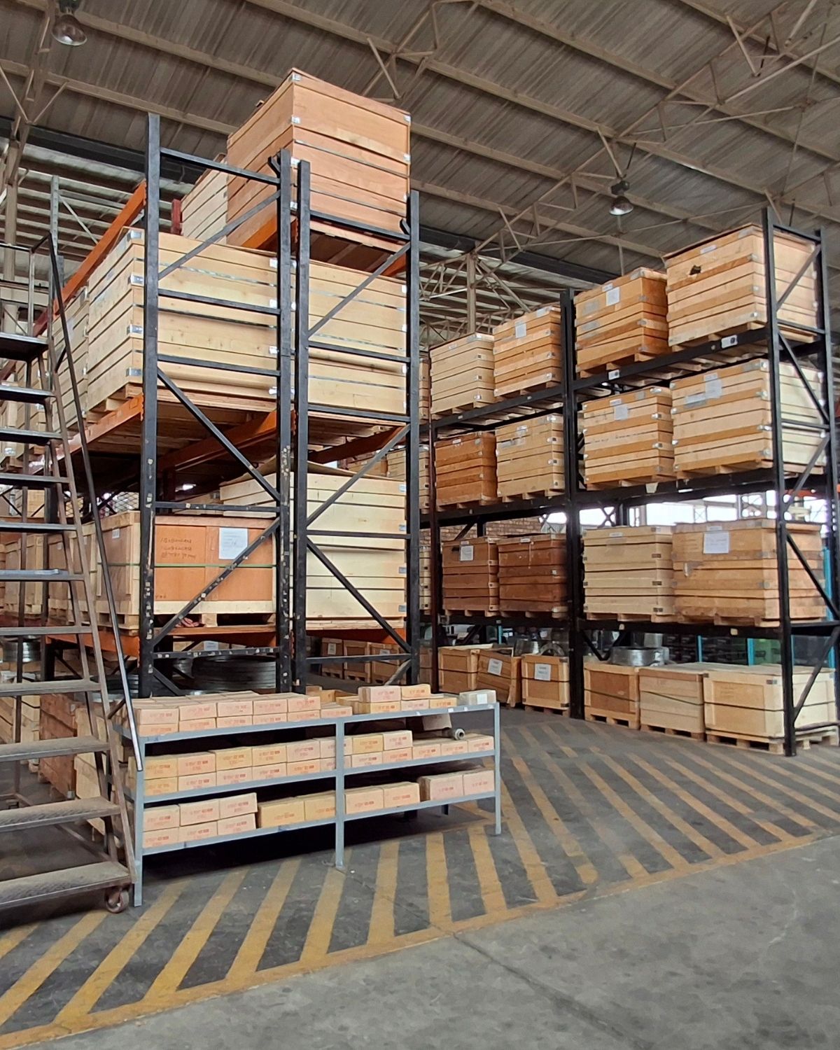 Sizwe Seals Industrial Storage Racking and Component Inventory Industrial warehouse area with high storage racking, wooden crates, boxed components and organised inventory inside the Sizwe Seals facility.